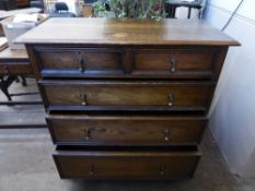 An Oak Chest of Drawers, two short drawers and three graduated long drawers, brass drop handles,