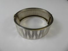 A Silver Bangle, mm DJ, stamped 925.