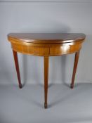 A Mahogany Inlaid Card Table, with green baize interior, raised on tapered legs with spade feet,