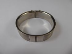 A Lady's Engine Turned Silver and 9ct Gold Bangle, engraved Rose, approx 28.7 gms.