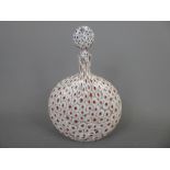 A Murano Glass Bottle and Stopper, with cranberry canes on white ground, approx 21 cms.