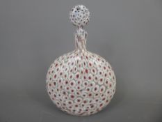 A Murano Glass Bottle and Stopper, with cranberry canes on white ground, approx 21 cms.