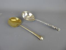 An American Sterling Silver-Gilt Serving Spoon, the bowl of the spoon embossed with a palm frond.