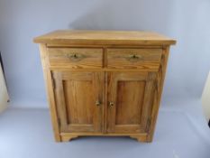 A Pitch Pine Cupboard, with two drawers and two cupboards beneath, approx 79 x 48 x 78 cms.