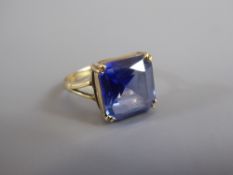 A 9ct Yellow Gold Blue Stone Ring, size M together with a white metal amethyst ring, size L.