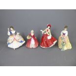 Four Royal Doulton Figurines, including 'Alexandra', 'Christine', 'Janet' and 'Christmas Day'. (4)