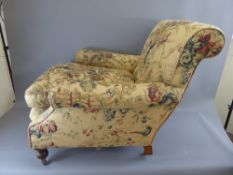 A Victorian Arm Chair, with floral upholstery.