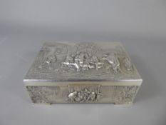 A Dutch Silver Trinket Box, the hinged lid depicting a tavern scene in relief, approx 14 x 10 x 4.