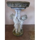 A Vintage Stone Bird Bath depicting Cherubs