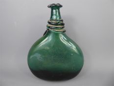 A 19th Century Arabic Green Glass Saddle Flask.