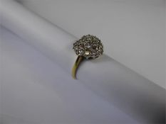 An 18ct Yellow and White Heart-Shape Gold Diamond Ring.