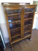 An Oak Glaze Fronted Book Case.