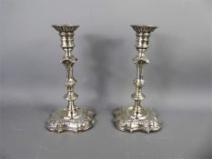 A Pair of Silver Candlesticks,