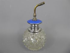 A Large Cut Glass and Blue Enamel Perfume Atomizer.