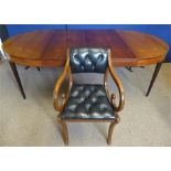 A Rosewood Circular Dining Table and Chairs
