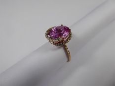 An 18k Gold Pink Sapphire Ring.