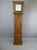 An Oak Cased Art Deco Clock.