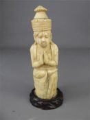 An Antique Carved Ivory Figure of a Priest Praying