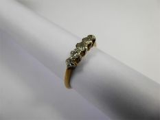 An 18ct Yellow Gold and Platinum Five Stone Diamond Ring