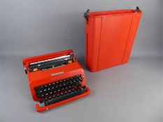 A Smart Red Olivetti Valentine Portable Typewriter in Case.
