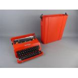 A Smart Red Olivetti Valentine Portable Typewriter in Case.