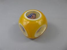 A 20th Century Faceted Millefiori Amber Glass Paperweight.
