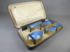 A Vintage Leather Blue Enamel & Silver Vanity Set.