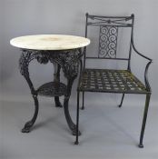 A Cast Iron and White Marble Top Circular Garden Table and Chair.