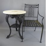 A Cast Iron and White Marble Top Circular Garden Table and Chair.