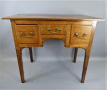 An Edwardian Oak Dressing Table.