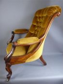 A Victorian Walnut Framed Elbow Chair, on cabriole legs and castors.