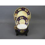 A Royal Worcester Cabinet Cup, Saucer and Plate