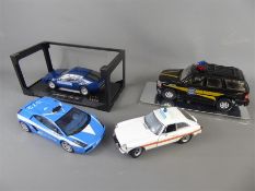 A Quantity of Die-cast 1:18 Police Cars.