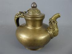 A Bronze or Brass Tibetan Teapot.