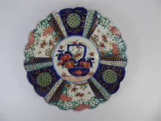 A Hand Painted Antique Japanese Imari Plate Depicting a Central Cartouche Flower Basket