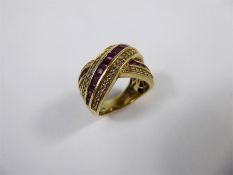 A 18 ct Yellow Diamond and Ruby Cross-Over Ring