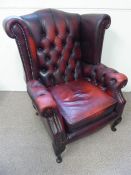 A Burgundy Chesterfield-Style Button-Back Arm Chair