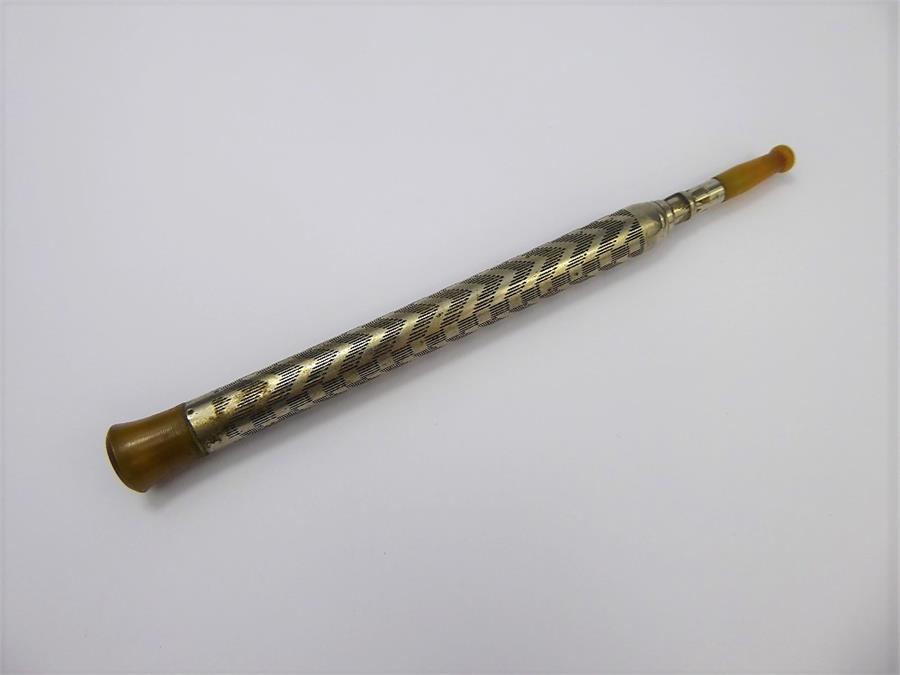 A Vintage White Metal and Horn Telescopic Cigarette Holder