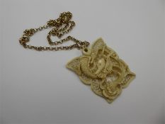 A Chinese Antique Carved Ivory Dragon Pendant