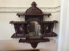 A Decorative Indian Ornately Carved Wall Mirror.