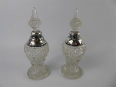 A Pair of Cut Glass and Silver Perfume Bottles