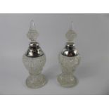 A Pair of Cut Glass and Silver Perfume Bottles