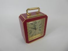 A Promotional 'Howard Miller' Red Enamel Quartz Clock