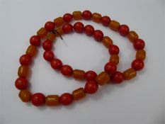 A Butterscotch and Red Amber Beaded Necklace