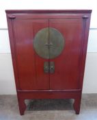 A Late 19th Century Chinese Red Painted Wedding Cabinet