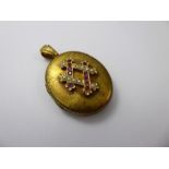 An Antique 14 ct Yellow Gold, Ruby and Pearl Double Locket