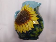 A Moorcroft Blue Jug Decorated with Sunflowers