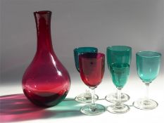 A Victorian Cranberry Glass Decanter and Glasses