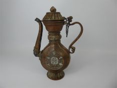 A 18th Century Tibetan Copper and Silver Libation Ewer