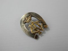 An Austro-Hungarian Silver and Gold Military Cap Badge